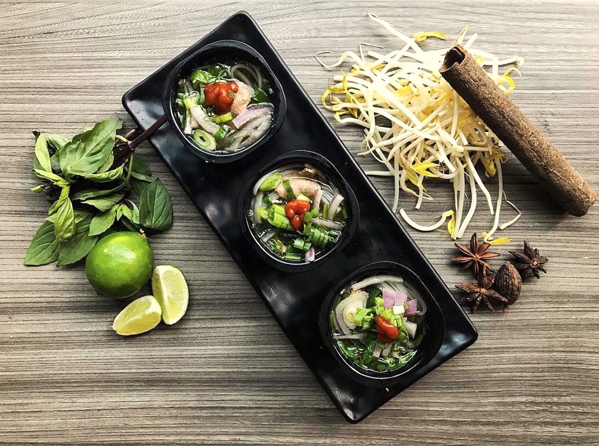Three cups of phở with Thai basil, lime, bean sprouts, cinnamon bark and star anise